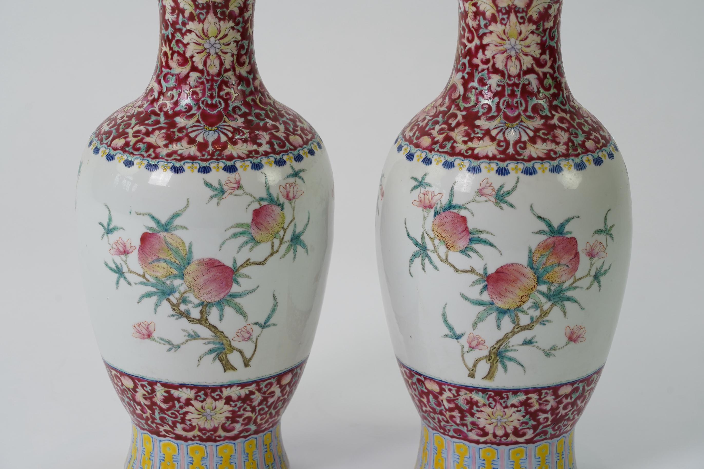 A pair of Chinese famille rose ‘sanduo’ vases, Qianlong seal mark, 19th century